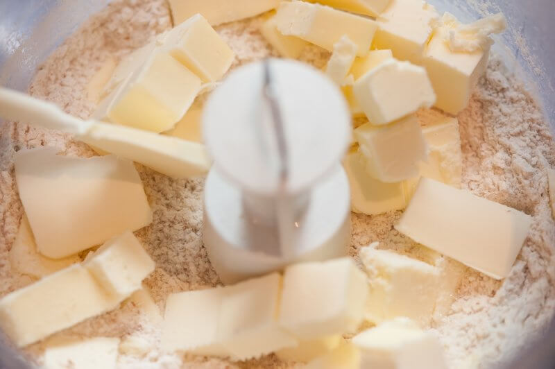 Flours, almonds, sugar, vanilla, salt just before the butter is incorporated.