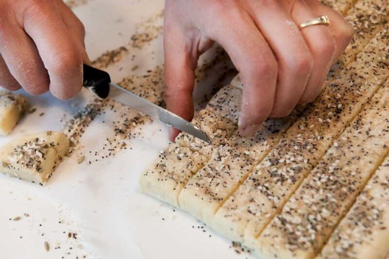 Cutting the dough into squares.