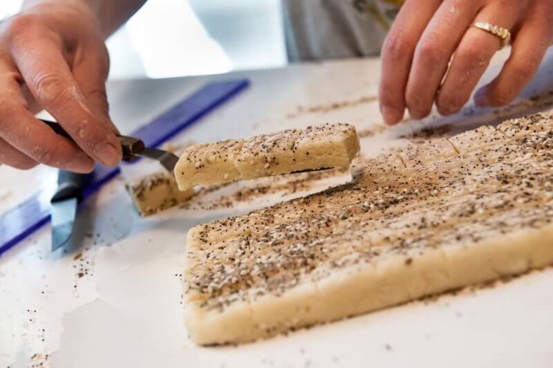 Lifting the squares onto the tray.