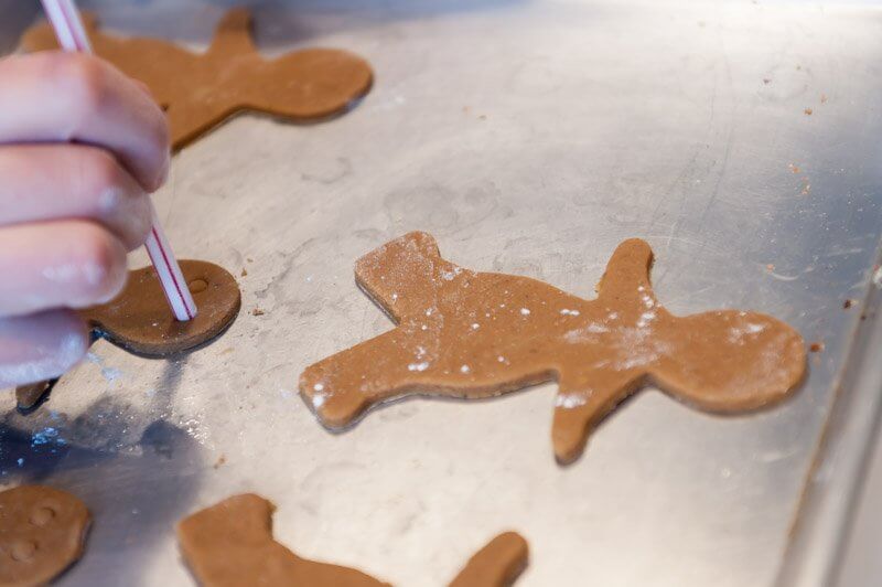 Marking the eyes of the Gingerbread men.