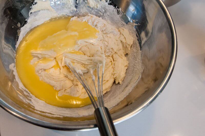 Cooled butter added to the madeleine batter (not so gradually).