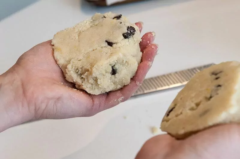 The cookie dough cut in half.