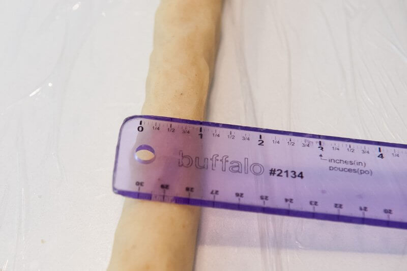 Roll the cookie dough to one inch in diameter.