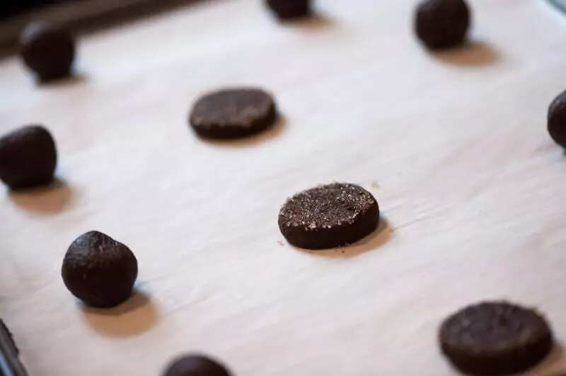 A tray of cookies half made.