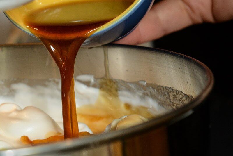 Vanilla and lemon juice going into the meringue