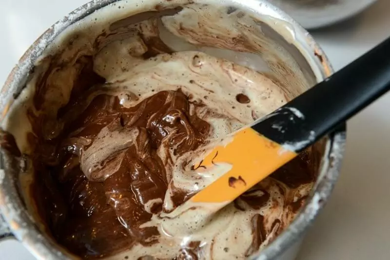 Lightening the chocolate and flour mixture.