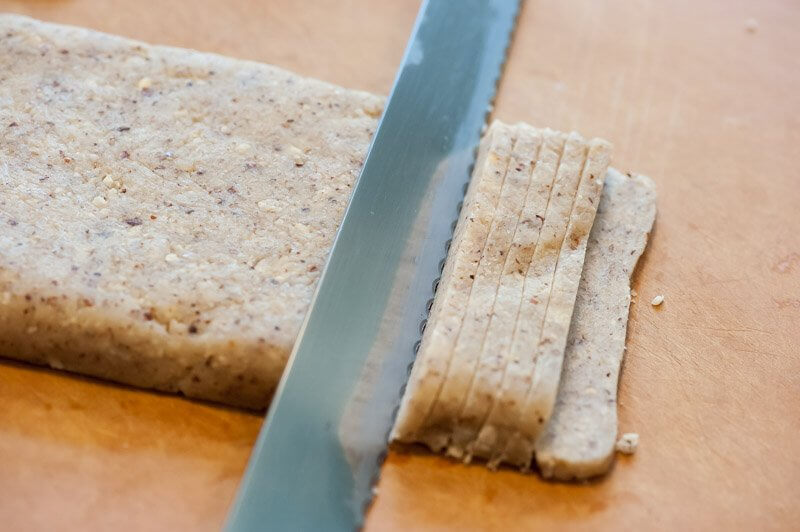 Slicing the cold cookie dough.