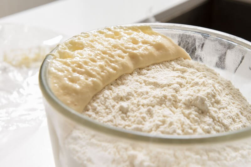 Babka dough starter eating through the flour blanket.