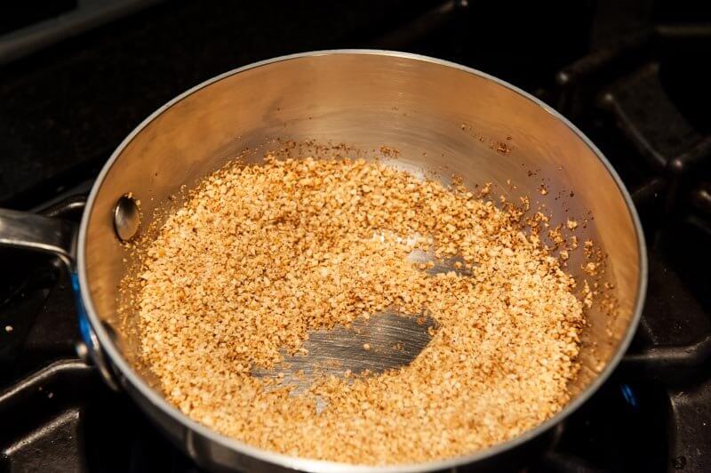 Toasting ground almonds.