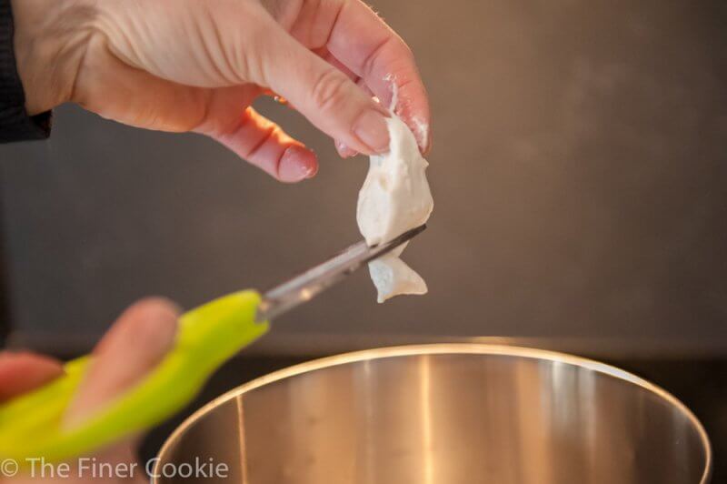 Adding the Biga to the water for the dough starter.