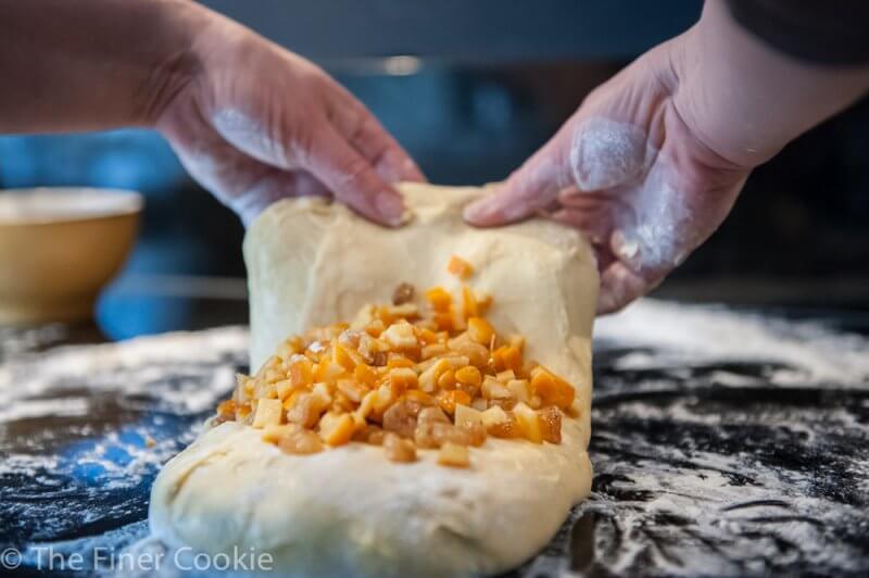 Folding in the candied oranges.