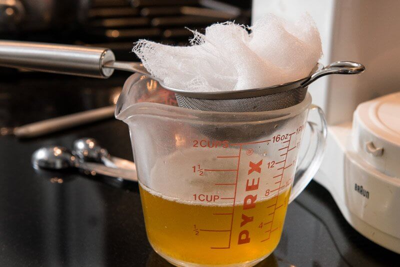 Filtering the browned butter.