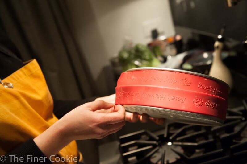 Not having any idea what’s ahead, I stretch the cake strips onto the over-prepared pan.