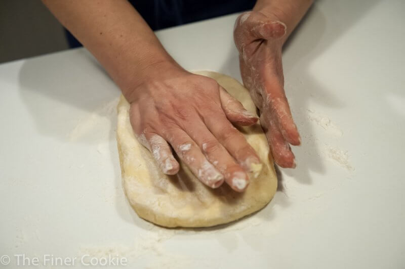 Pushing the dough into place.