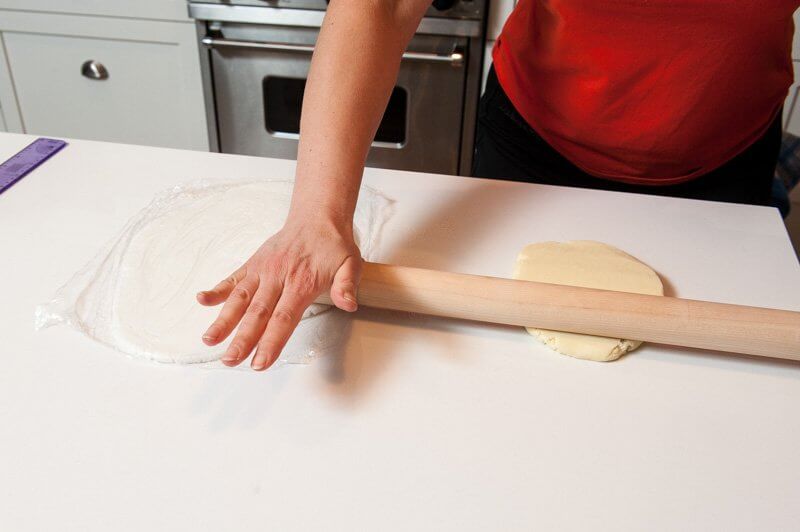 Rolling the white chocolate plastique.
