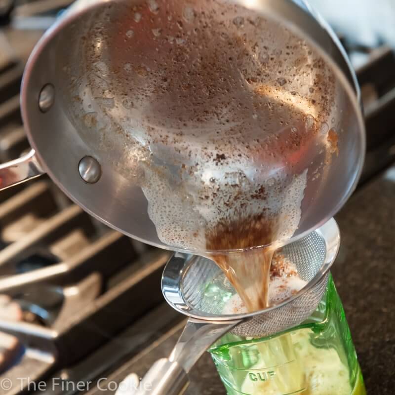 Straining the clarified butter.