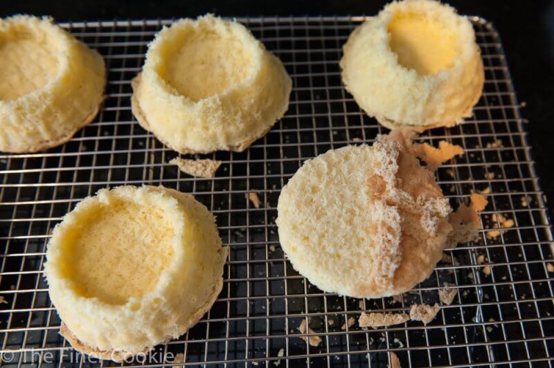 Removing the crust from the cakes before syruping them.