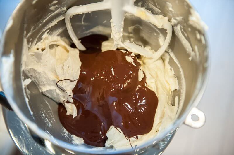 Adding the chocolate to the luscious cake batter.
