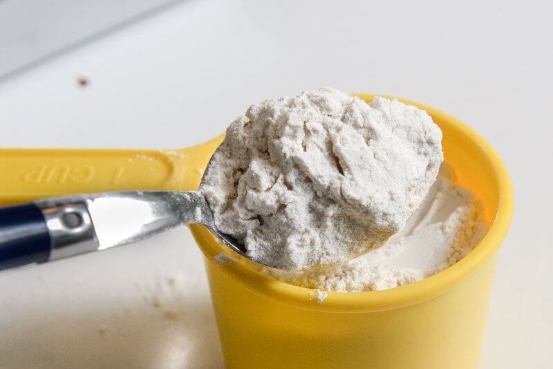 Spoon flour into a volume measuring cup.