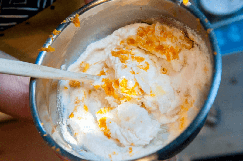 Grated orange zest in a sweet ricotta filling.