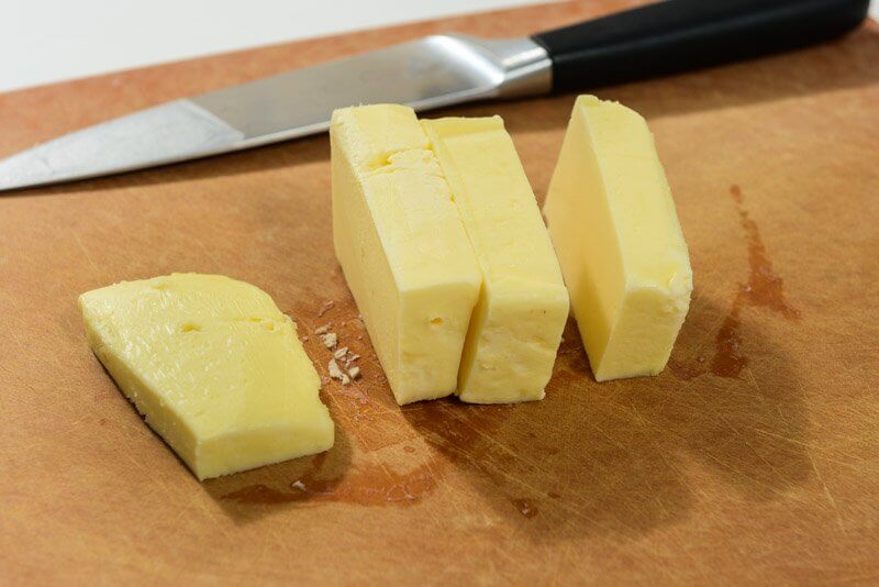 Cut the butter in large chunks to warm it quickly rather than using the microwave.