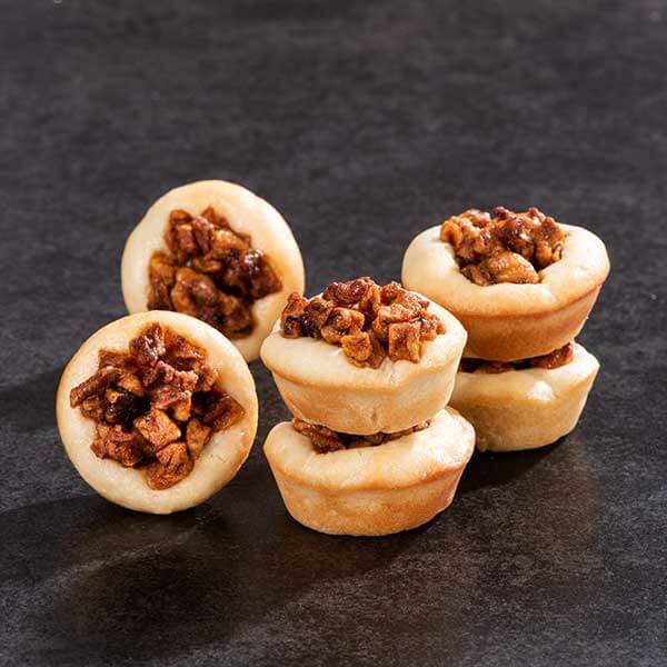 Apple pie cookies, stacked on table