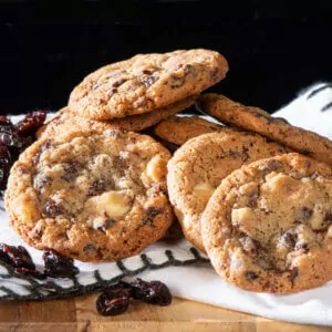 cherry bomb cookies placed on tea towel with decorative cherries