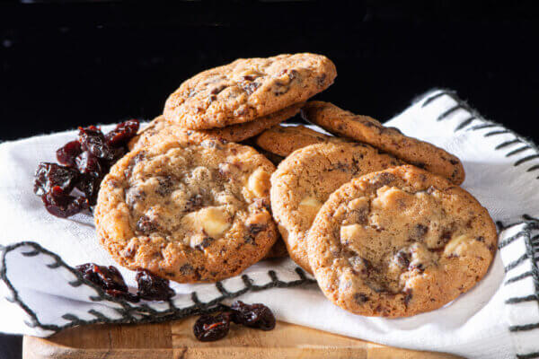 cherry bomb cookies placed on tea towel with decorative cherries