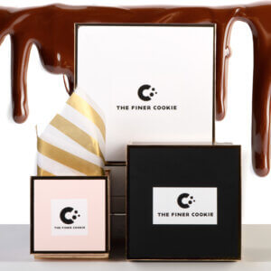 Gift boxes with melted chocolate in the background