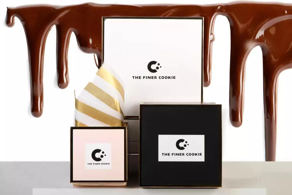 Gift boxes with melted chocolate in the background